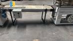Automatic L-sealer with shrink tunnel.