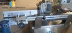 Automatic self-adhesive labeling machine for cylindrical bottles