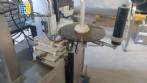 Automatic self-adhesive labeling machine for cylindrical bottles