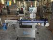 Automatic self-adhesive labeling machine for cylindrical bottles