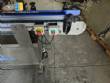 Automatic self-adhesive labeling machine for cylindrical bottles