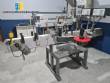 Automatic labeling machine for bottles, jars, and containers, for self-adhesive labels.