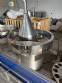 Milainox automatic rotary filling, dosing, and sealing machine for cups, pots, and jars.
