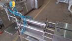 Filling machine with 2 nozzles for liquids and pilfer cap screwer