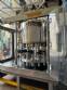 Stainless steel rotary filling machine with 16 IMSB nozzles for bottles and jars