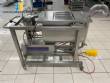 Unifiller stainless steel dosing pump with homogenizing mixer for bakery foods.
