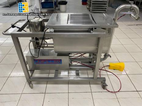 Unifiller stainless steel dosing pump with homogenizing mixer for bakery foods.