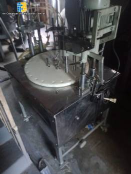 Erli rotary liquid filling machine with 4 pistons, 14,400 units per hour.