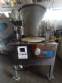 Erli rotary liquid filling machine with 4 pistons, 14,400 units per hour.