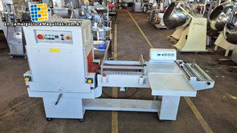 L-shaped packaging sealer with semi-automatic shrink tunnel.