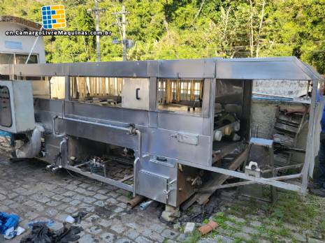 Filling line for 10 and 20 liter gallon jugs with filling machine and rinser/washer.