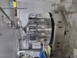 Filling line for 10 and 20 liter gallon jugs with filling machine and rinser/washer.