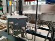Automatic labeler for flat bottles