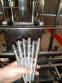 Linear filling machine and automatic threading machine