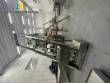 Multi-head packaging machine for pots and flasks