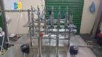 Linear filling machine with 6 pistons filling system