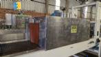 Labeling machine with steam sleeve tunnel and bottle baler