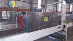 Labeling machine with steam sleeve tunnel and bottle baler
