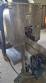 Labeling machine with steam sleeve tunnel and bottle baler