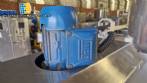 Labeling machine with steam sleeve tunnel and bottle baler