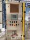Zegla rotary filling machine with rinser and three-block capping system.