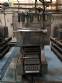 Automatic filling and sealing machine for gelatin cups, 12,000 units/hour.