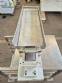 Vibrating trough for multi-head scale